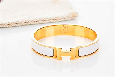 hermes bracelet gold and white.